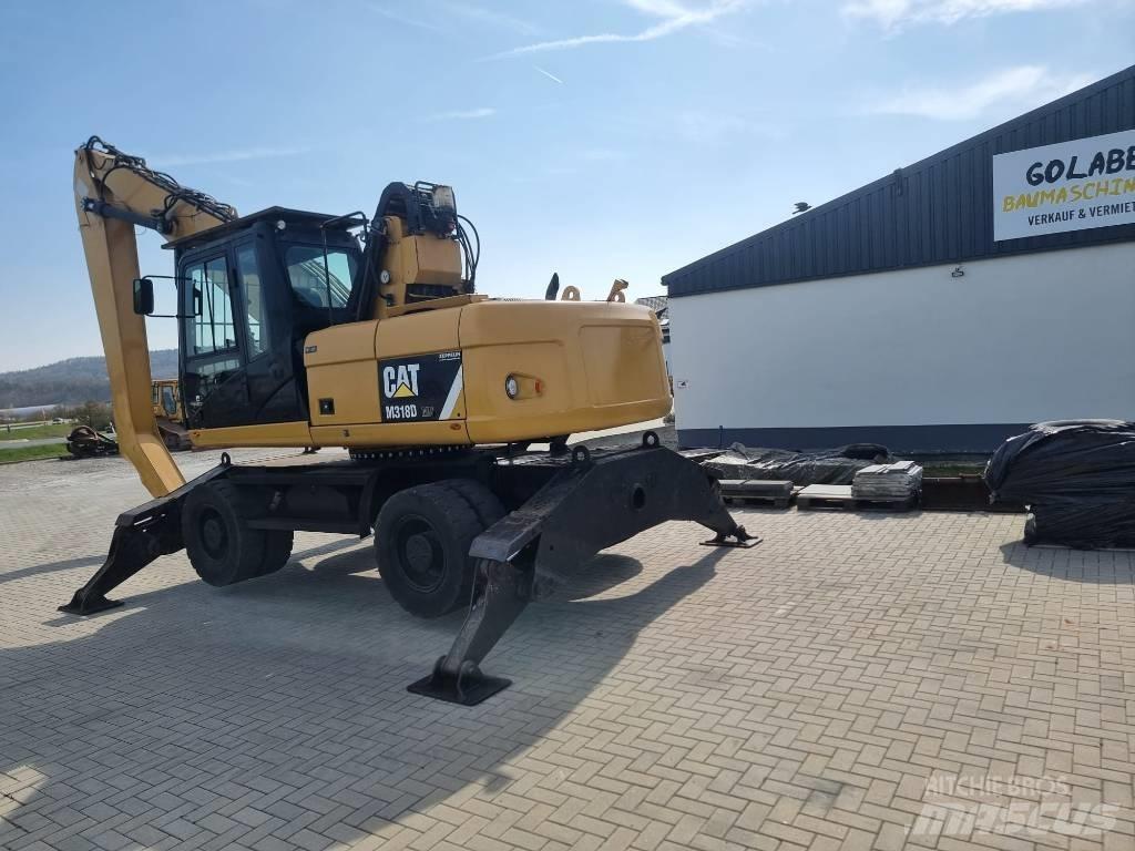 CAT 318D Materialumschlag